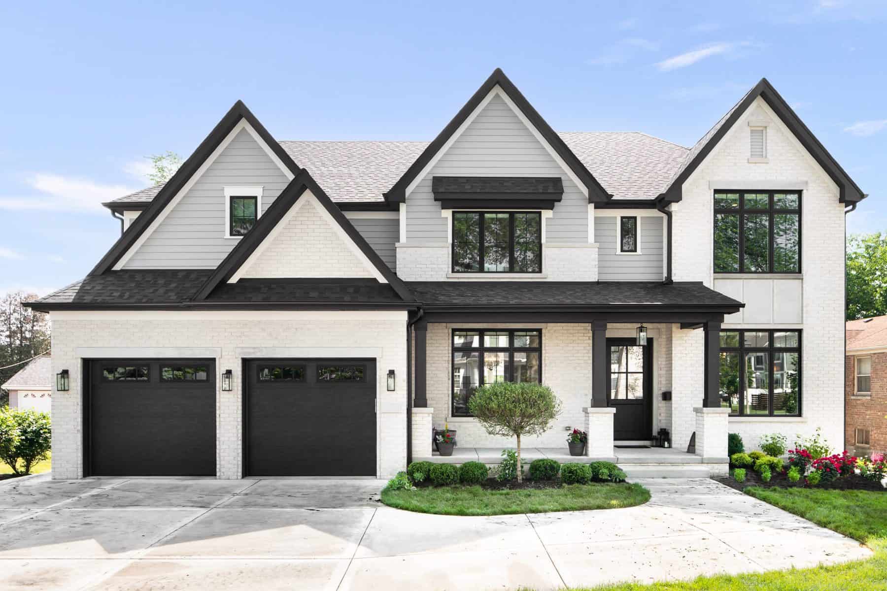 Lori K Home - house with wide siding and dark doors, window frames